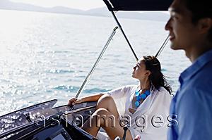 Asia Images Group - Couple on yacht, looking away