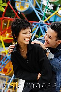 Asia Images Group - Couple at playground, laughing