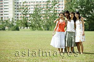 Asia Images Group - Young women standing together, smiling at camera
