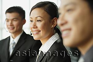 Asia Images Group - Customer service officers, in a row