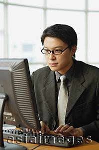 Asia Images Group - Businessman using computer