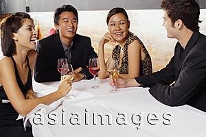 Asia Images Group - Couples sitting in restaurant, drinking wine and talking
