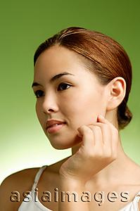 Asia Images Group - Woman touching face, headshot