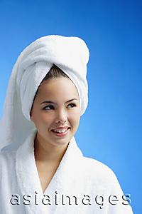 Asia Images Group - Young woman wearing white bathrobe and towel turban, head shot