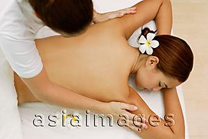 Asia Images Group - Young woman having a body massage