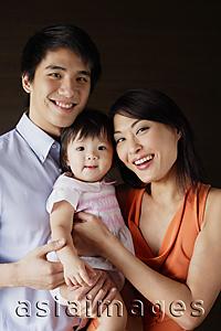 Asia Images Group - Family with one child, looking at camera, portrait