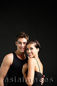 Asia Images Group - Couple standing cheek to cheek, smiling at camera
