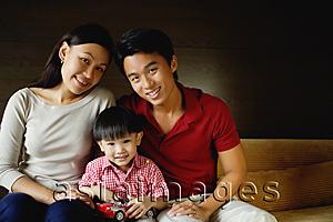 Asia Images Group - Family of three, smiling at camera, portrait