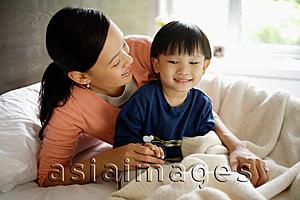 Asia Images Group - Mother and son in bedroom
