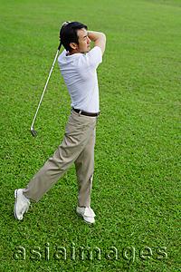 Asia Images Group - Mature man playing golf