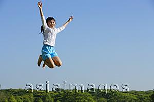 Asia Images Group - Girl jumping in mid air