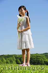 Asia Images Group - Girl holding bouquet of flowers