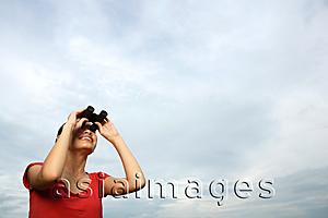 Asia Images Group - Woman with binoculars