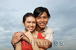 Asia Images Group - Couple embracing, smiling at camera