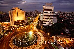 Asia Images Group - Early evening view of the Hotel Indonesia roundabout, Welcome monument and buildings along Jalan Thamrin, Jakarta