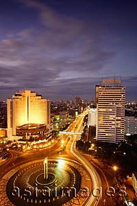 Asia Images Group - Early evening view of the Hotel Indonesia roundabout, Welcome monument and buildings along Jalan Thamrin, Jakarta