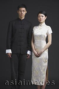 Asia Images Group - Couple dressed in traditional Chinese attire, posing for studio portrait