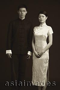 Asia Images Group - Man and woman dressed in traditional Chinese attire, posing for studio portrait
