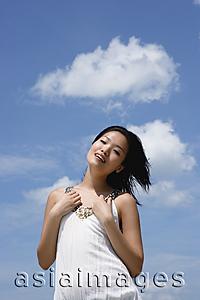 Asia Images Group - Woman in white top, smiling at camera