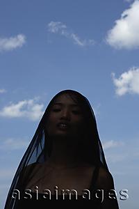 Asia Images Group - Woman with black scarf over her head