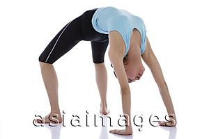 Asia Images Group - Female gymnast doing the Bridge position