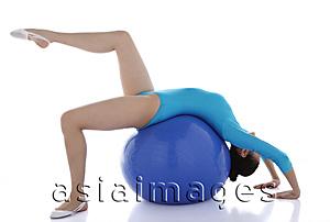 Asia Images Group - Gymnast balancing on fitness ball