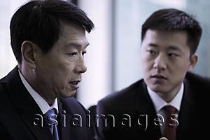 Asia Images Group - Head shot of two businessmen