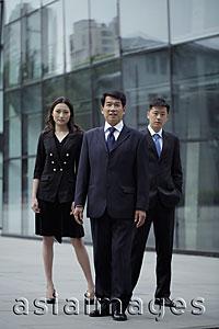 Asia Images Group - Business people standing in front of a building