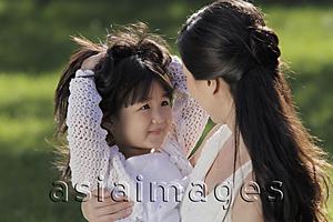 Asia Images Group - mother and daughter playing outside