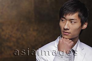 Asia Images Group - Young man in white coat