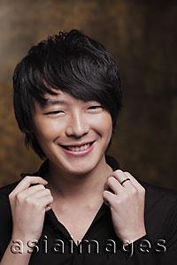 Asia Images Group - Head shot of young man smiling
