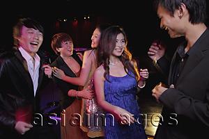 Asia Images Group - Young people dancing in a club at night