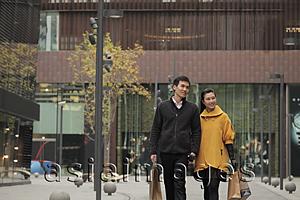 Asia Images Group - Young couple shopping together outdoors