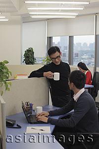 Asia Images Group - Three people working in an office