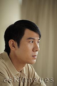 Asia Images Group - Profile of young man looking sad