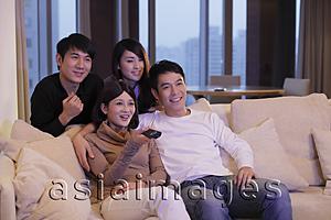 Asia Images Group - Four people watching TV together