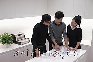 Asia Images Group - Three people working together in modern office