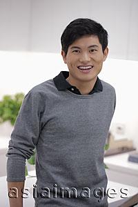 Asia Images Group - Head shot of young man smiling