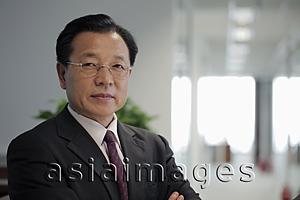 Asia Images Group - Head shot of business man in office