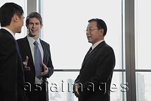 Asia Images Group - Three businessmen talking together