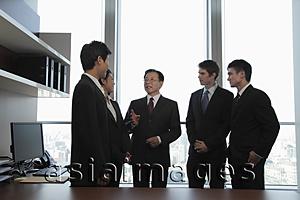 Asia Images Group - A small group of business people talking together
