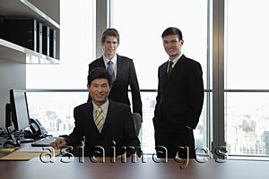 Asia Images Group - Three businessmen working together in an office