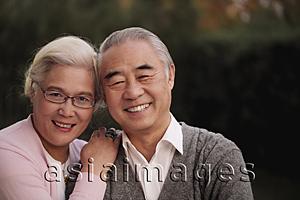 Asia Images Group - Head shot of older couple smiling together
