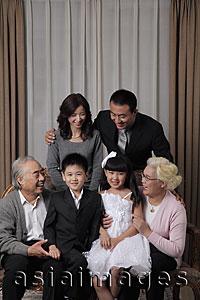 Asia Images Group - Three generation family smiling at each other