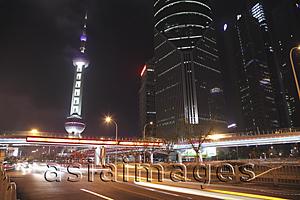 Asia Images Group - Shanghai streets at night with The Oriental Pearl Tower in background