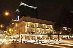 Asia Images Group - Light stream from traffic in front of the Hotel Continental at night, Ho Chi Minh, Vietnam