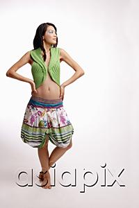 AsiaPix - Young woman, standing, hands on hip, looking away