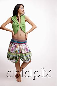 AsiaPix - Young woman, standing, hands on hip, eyes closed