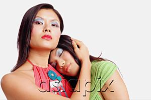 AsiaPix - Two women, one looking at camera, the other resting with eyes closed