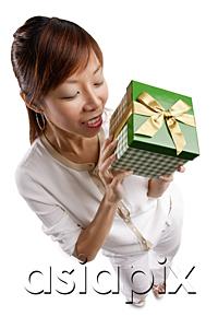 AsiaPix - Woman standing, holding gift